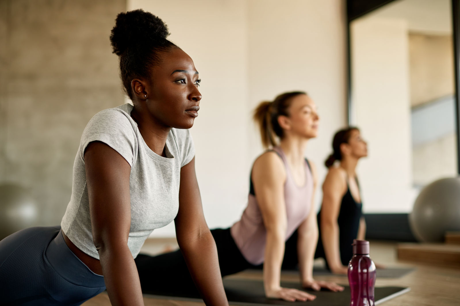 athletic woman stretching during exercise class